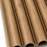 Close-up of a 15 × 240 × 1.5cm PVC panel showcasing deep oak grain and refined vertical fluted texture