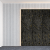 Bold dark stone surface featuring flowing golden veins for a luxurious and dramatic interior feature wall