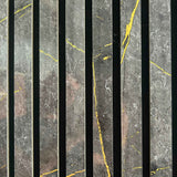 Close-up of a 60 × 240 × 1.5cm acoustic panel showcasing deep black tones with elegant golden marble detailing