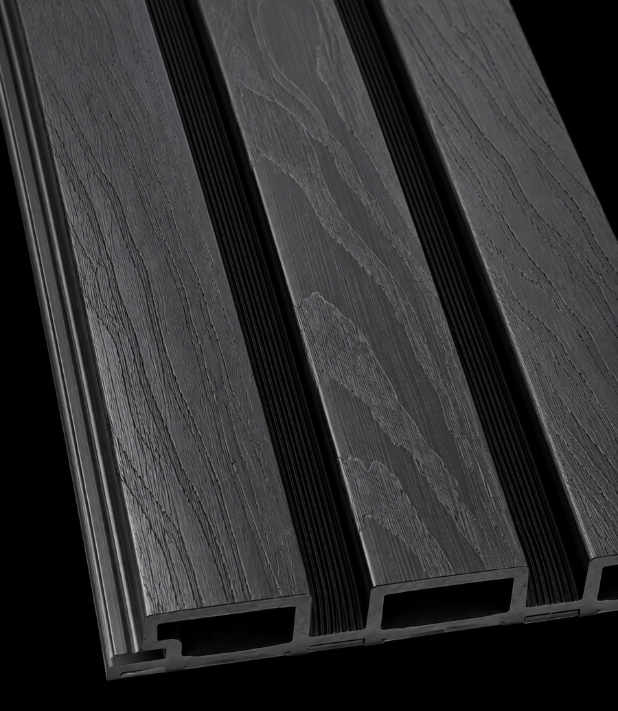 Close-up of a 15 × 240 × 1cm PVC panel highlighting rich walnut tones and realistic natural wood grain